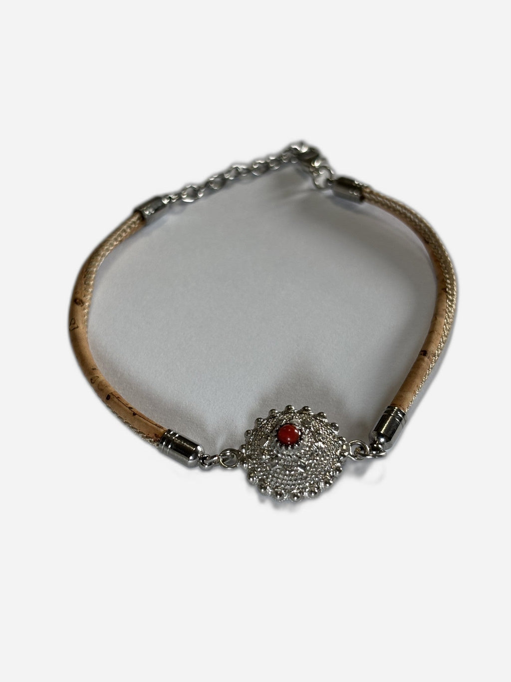 Bracelet with decorative clasp on a white background