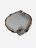 Bracelet with decorative clasp on a white background