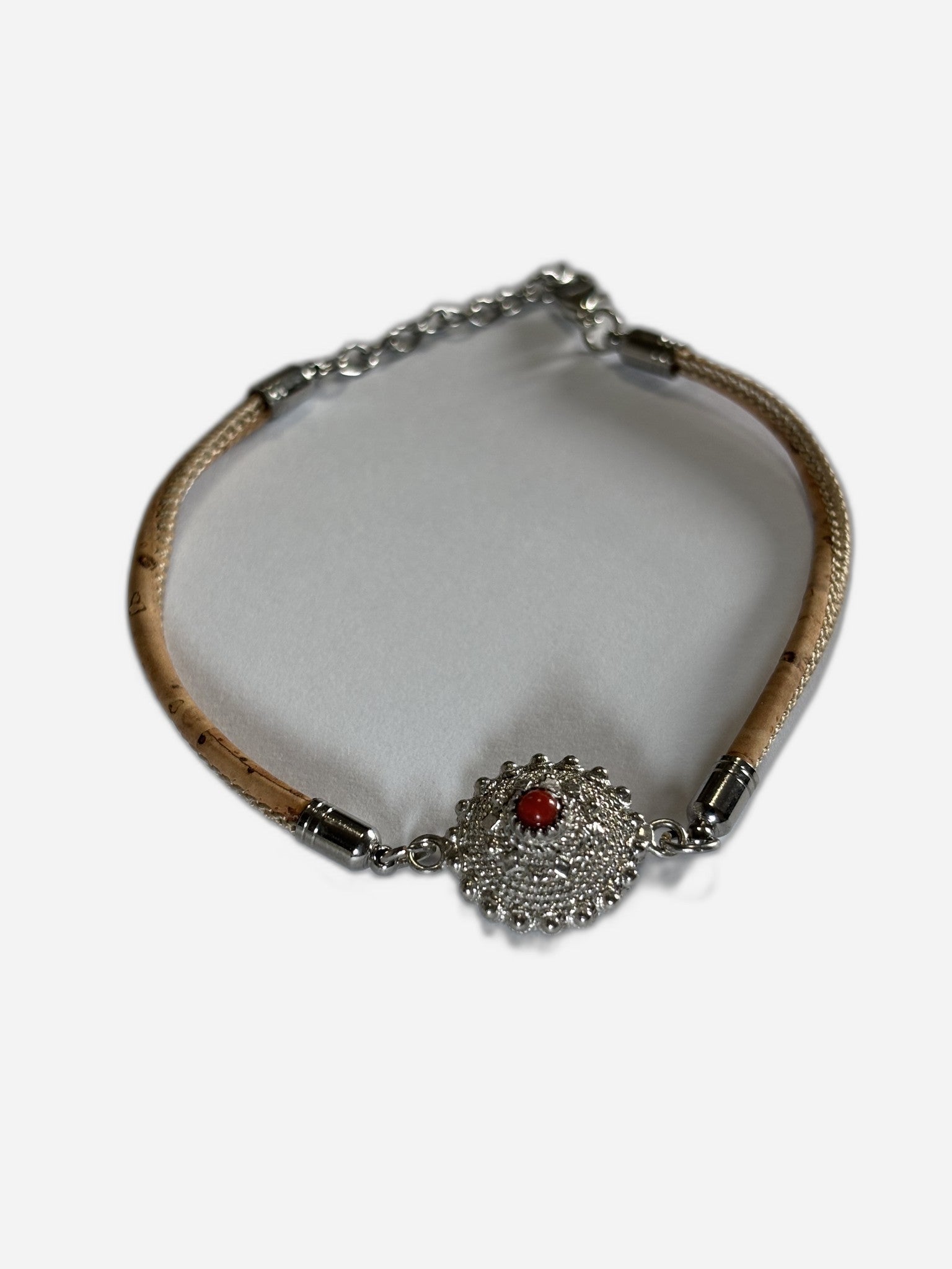 Bracelet with decorative clasp on a white background